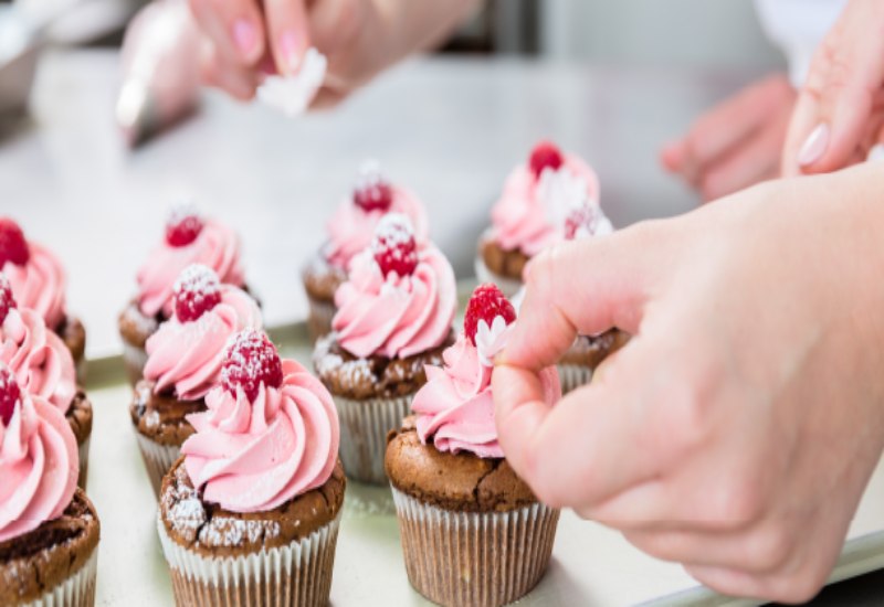 Cup cakes topped with berries