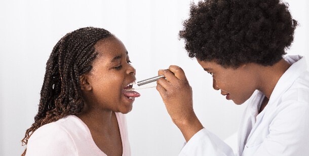 A girl gets treated for Pharyngitis