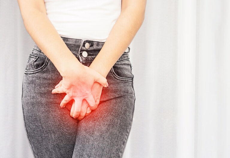 photo of a woman holding her crotch glowing red with discomfort