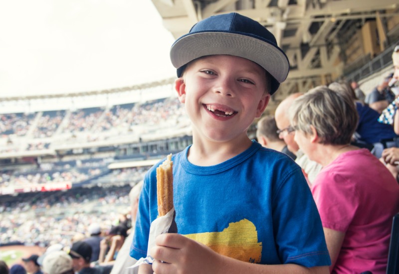 child at a baseball game in Houston, TX