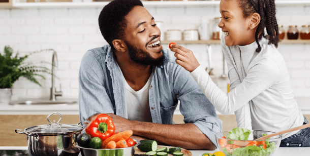 man and daughter cooking healthy meals with symptoms of celiac disease in Houston, TX