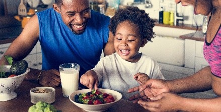 A family eats fruits and vegetables in Houston, TX